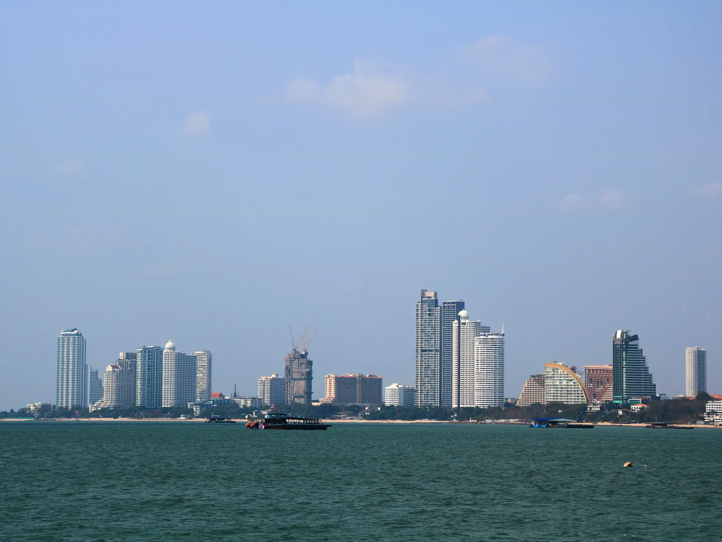 The northern Pattaya skyline and shoreline seen across the sea.